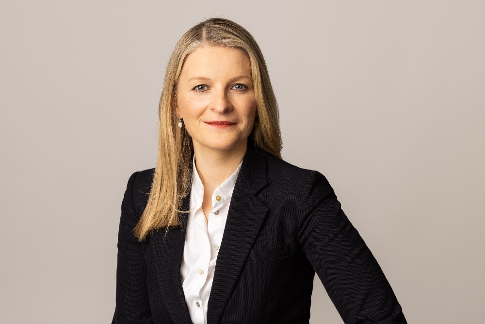 Fair-haired woman in business suit.