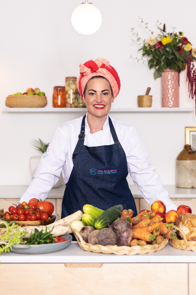Woman chef in kitchen.